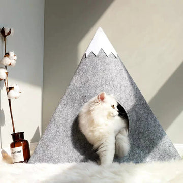 Felt cat bed mimicking a snowcapped mountain cat cave bed